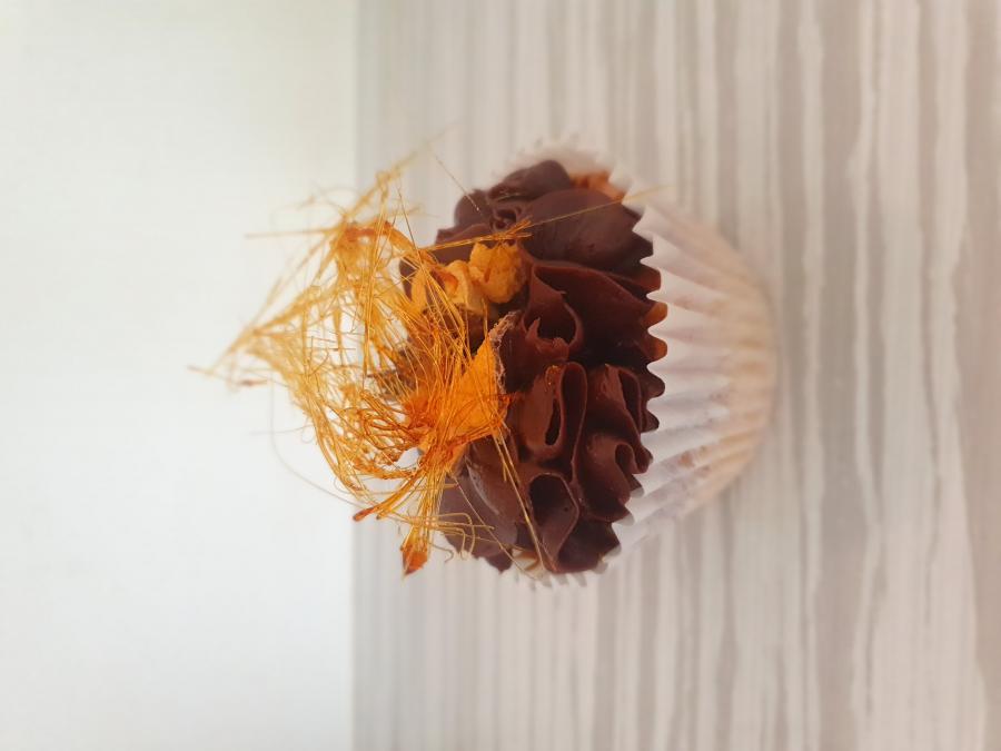 Chocolate cake with violet crumble chunks, topped with chocolate buttercream and violet crumble shards